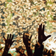 hands raised in air amid confetti